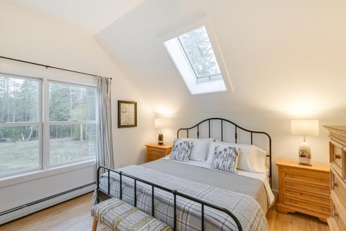 a bedroom with a bed and a window at Waterfront Deer Isle Apartment with Fire Pit in Deer Isle