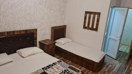 Ένα ή περισσότερα κρεβάτια σε δωμάτιο στο Mirage guesthouse