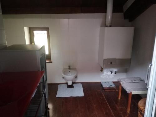 a bathroom with a toilet and a sink at Monastero Maggiore 2 in Cividale del Friuli