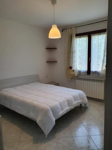 a bedroom with a large bed in a room at Mare Fuori Lacona in Capoliveri