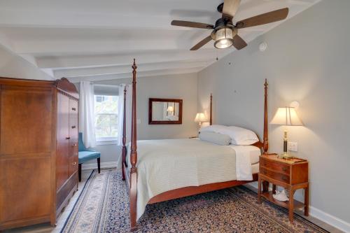 a bedroom with a bed and a ceiling fan at Historic Downtown Gem - Walk to Everything! in Fredericksburg