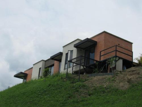 a house on the side of a hill at Studio Suite Campestre con Jacuzzi in Buga