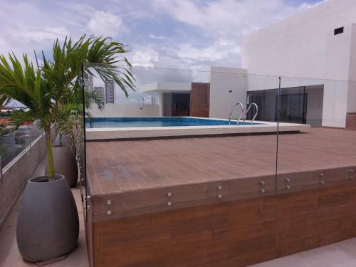 a house with a swimming pool on a roof at Monoambiente totalmente equipado in Santa Cruz de la Sierra