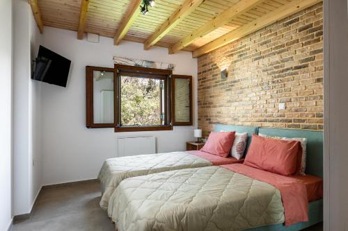 Postel nebo postele na pokoji v ubytování Eloise Apartments