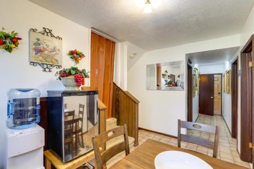 a dining room with a fish tank on a table at Spokane Valley Vacation Rental with Shared Pool! in Spokane Valley