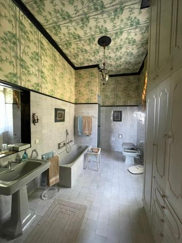 a bathroom with a tub and a sink and a toilet at Resort Villa San Luca CITR8031 in Imperia