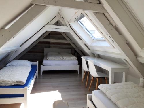 Postel nebo postele na pokoji v ubytování strandhuis De Bakkeete A