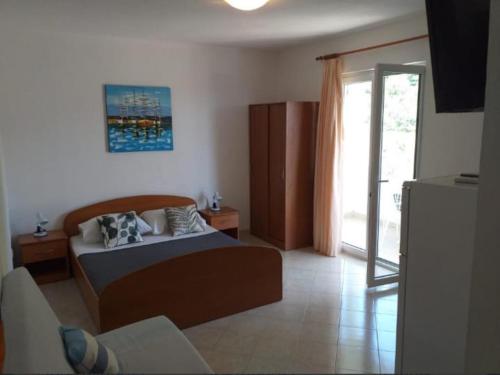 Postel nebo postele na pokoji v ubytování Studio apartmani Ante