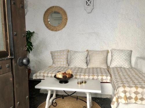 a living room with a couch and a table at Arya's Nest in Mijas