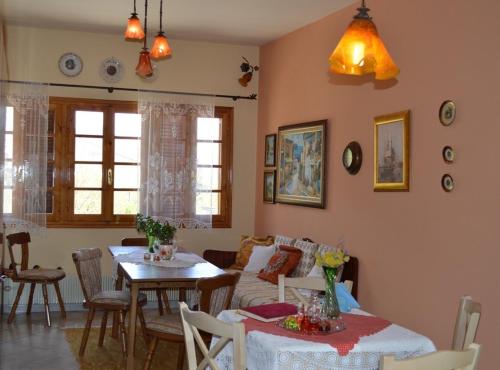 a living room with a table and a couch at Chrysoula's Guests in Ioannina