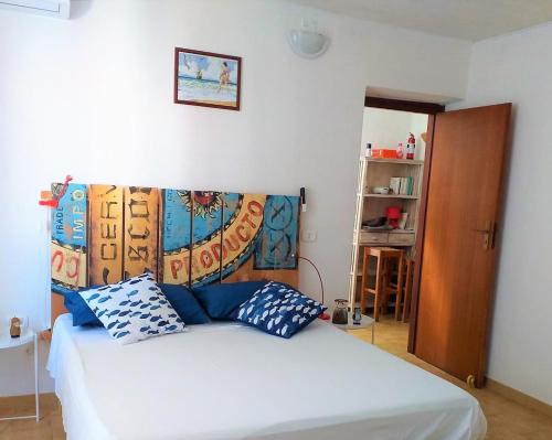Postel nebo postele na pokoji v ubytování una camera a Le Castella