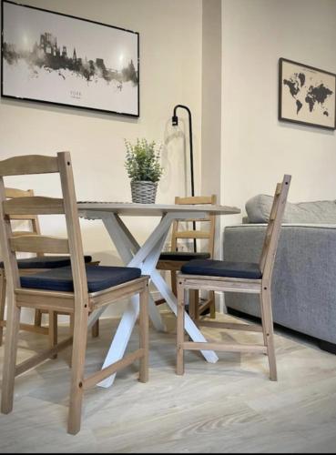 a dining room table with two chairs and a table at Moat View FREE PARKING, CENTRAL, EV PLUG in York