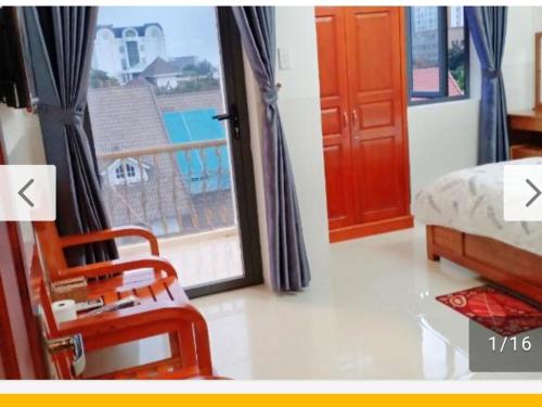 Ένα ή περισσότερα κρεβάτια σε δωμάτιο στο Minh Quân hotel