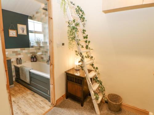 a bathroom with a christmas tree on the wall at The Nutshell in Chester-le-Street