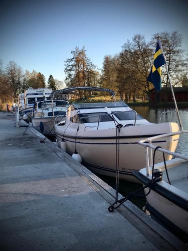 a group of boats docked at a dock at Hatty's Guesthouse in Motala