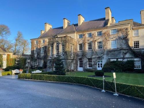 a large house with a street in front of it at Luxury 4 bedroom Lodge Mount Juliet Estate Thomastown Kilkenny in Thomastown