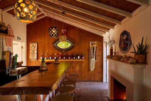 a bar in a restaurant with a wooden wall at Ojai Rancho Inn in Ojai