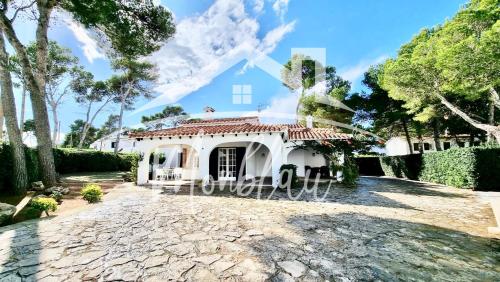 a villa with a view of the house at VILLA LORENZo in Cala Blanca