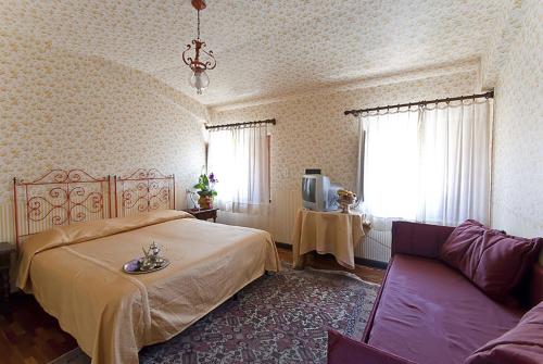 Postel nebo postele na pokoji v ubytování Hotel Maestoso