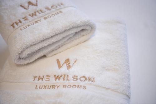 a white towel with the wixson library rooms on it at The Wilson Tirana in Tirana