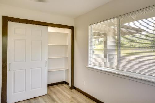 a room with a white door and a window at Keaau Getaway with Patio, 3 Mi to Shipman Beach! in Keaau