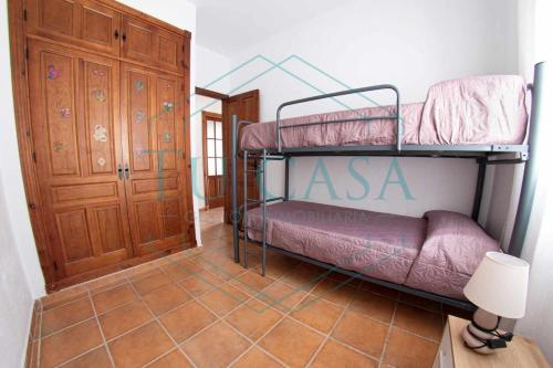 Våningssäng eller våningssängar i ett rum på Villa Castilla