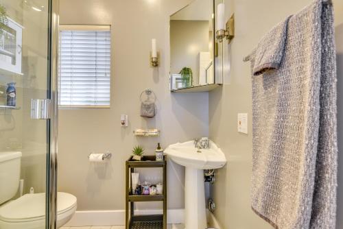 a bathroom with a sink and a toilet and a shower at Luxe Pasadena Casita with Fireplace and Grill in Pasadena