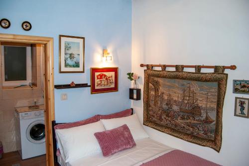 A bed or beds in a room at Yangos traditional home