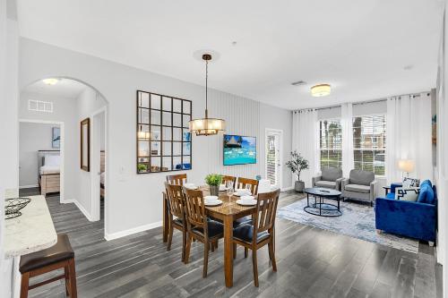 a dining room and living room with a table and chairs at Ground-Floor Vista Cay Condo Near Clubhouse Pool in Orlando