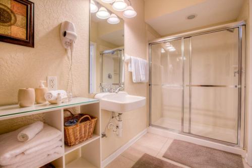 a bathroom with a shower and a sink at Resort Townhome: Perfect Orlando Vacation Spot in Orlando