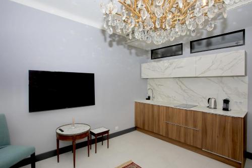 Televízia a/alebo spoločenská miestnosť v ubytovaní Appartement 5 min des plages Croisette