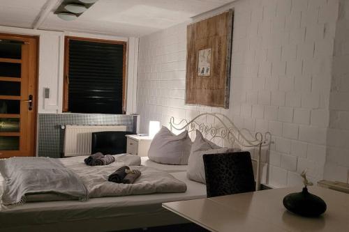 a bed with two stuffed animals laying on top of it at Villa Kunterbunt, W-Lan, Office in Leverkusen