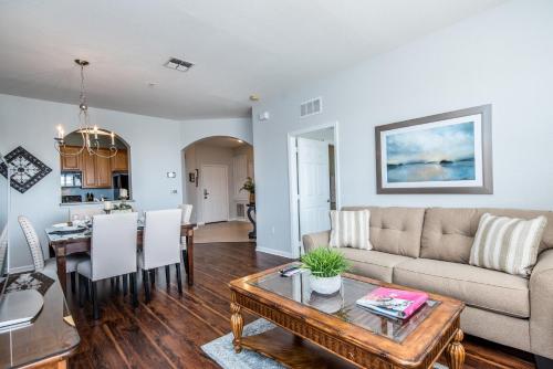 a living room with a couch and a table at Majestic Holiday in Orlando