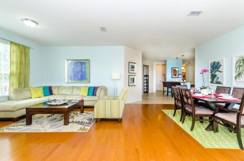 a living room with a couch and a table at Treasure Palace in Orlando