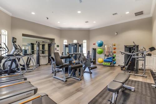 a gym with treadmills ellipticals and exercise machines at Florida Palms in Orlando