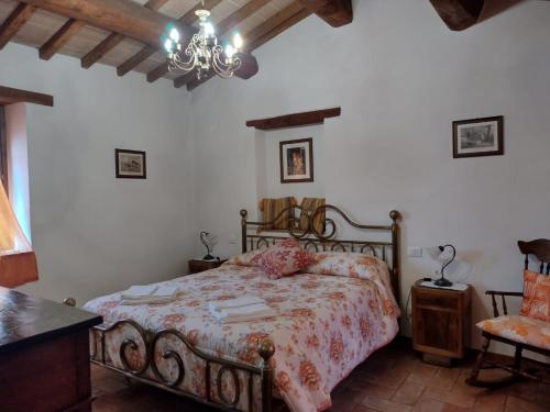 Ένα ή περισσότερα κρεβάτια σε δωμάτιο στο Agriturismo San Luciano