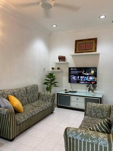 Χώρος καθιστικού στο Gemilang Guesthouse