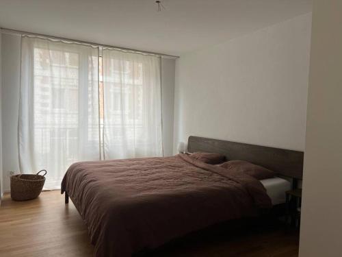Postel nebo postele na pokoji v ubytování Modern and cozy appartment in Basel city