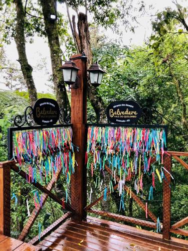 a gate with a bunch of streamers on it at Vista do Vale! 400 metros da Rua Coberta - Acomoda até 4 hóspedes in Gramado