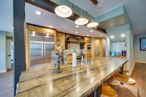 a large kitchen with a large wooden counter top at Lakefront Afton Home with Hot Tub and Game Room! in Afton