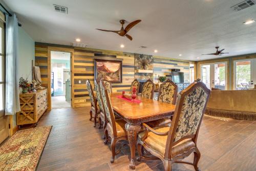 a dining room with a wooden table and chairs at Lakefront Afton Home with Hot Tub and Game Room! in Afton