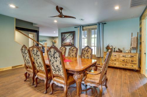 a dining room with a wooden table and chairs at Lakefront Afton Home with Hot Tub and Game Room! in Afton