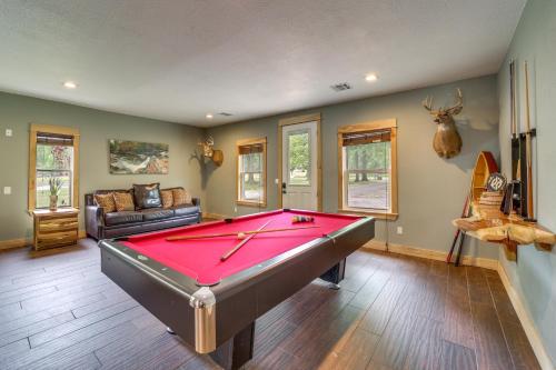 a living room with a pool table in it at Lakefront Afton Home with Hot Tub and Game Room! in Afton