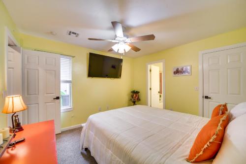 a bedroom with a bed and a ceiling fan at Lakefront Afton Home with Hot Tub and Game Room! in Afton