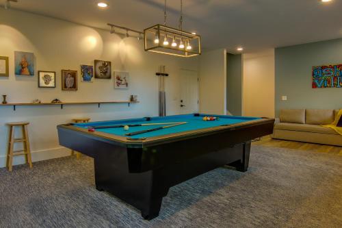 a living room with a pool table and a couch at Modern Fairview Retreat Spacious Deck and Mtn View! in Fairview