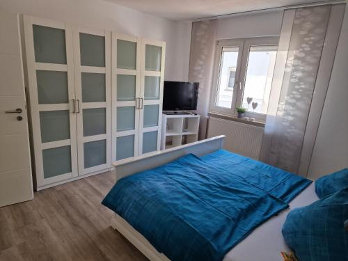 Katil atau katil-katil dalam bilik di Ferienhaus SteigRhein