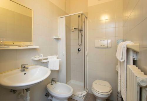 a bathroom with a sink and a toilet and a shower at Hotel Solarium in Civitanova Marche