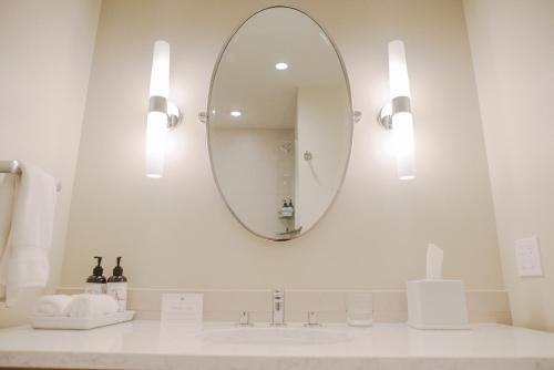 a bathroom with a sink and a mirror at Outlook Inn on Orcas Island in Eastsound