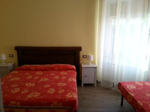 Ein Bett oder Betten in einem Zimmer der Unterkunft Lindavacanza