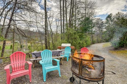 a group of chairs sitting around a fire pit at Whittier Vacation Rental Cabin Pets Welcome! in Whittier